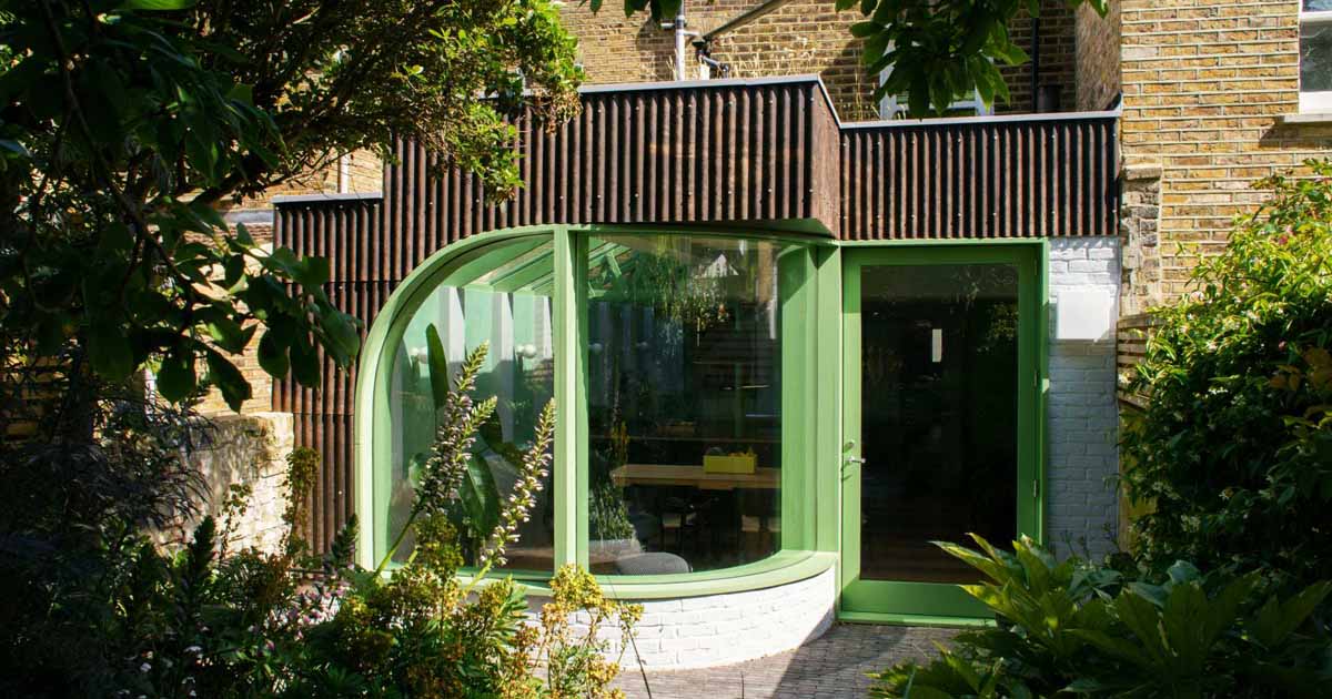 a-house-extension-with-a-curved-window-makes-room-for-a-new-kitchen-at-this-home-in-london