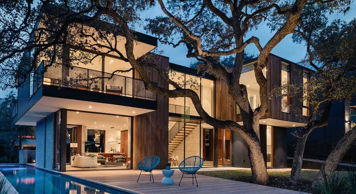 this-modern-home-was-designed-around-a-split-trunk-oak-tree