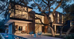 this-modern-home-was-designed-around-a-split-trunk-oak-tree