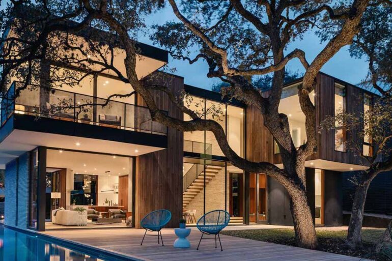 this-modern-home-was-designed-around-a-split-trunk-oak-tree