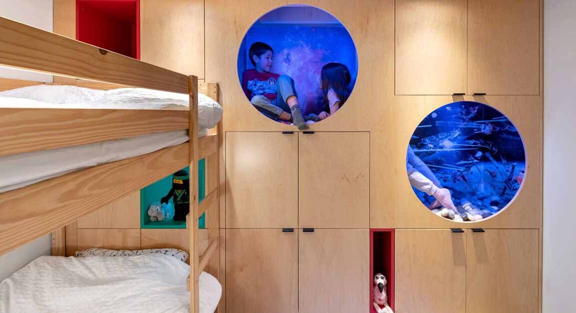 a-kid's-bedroom-with-built-in-reading-nooks