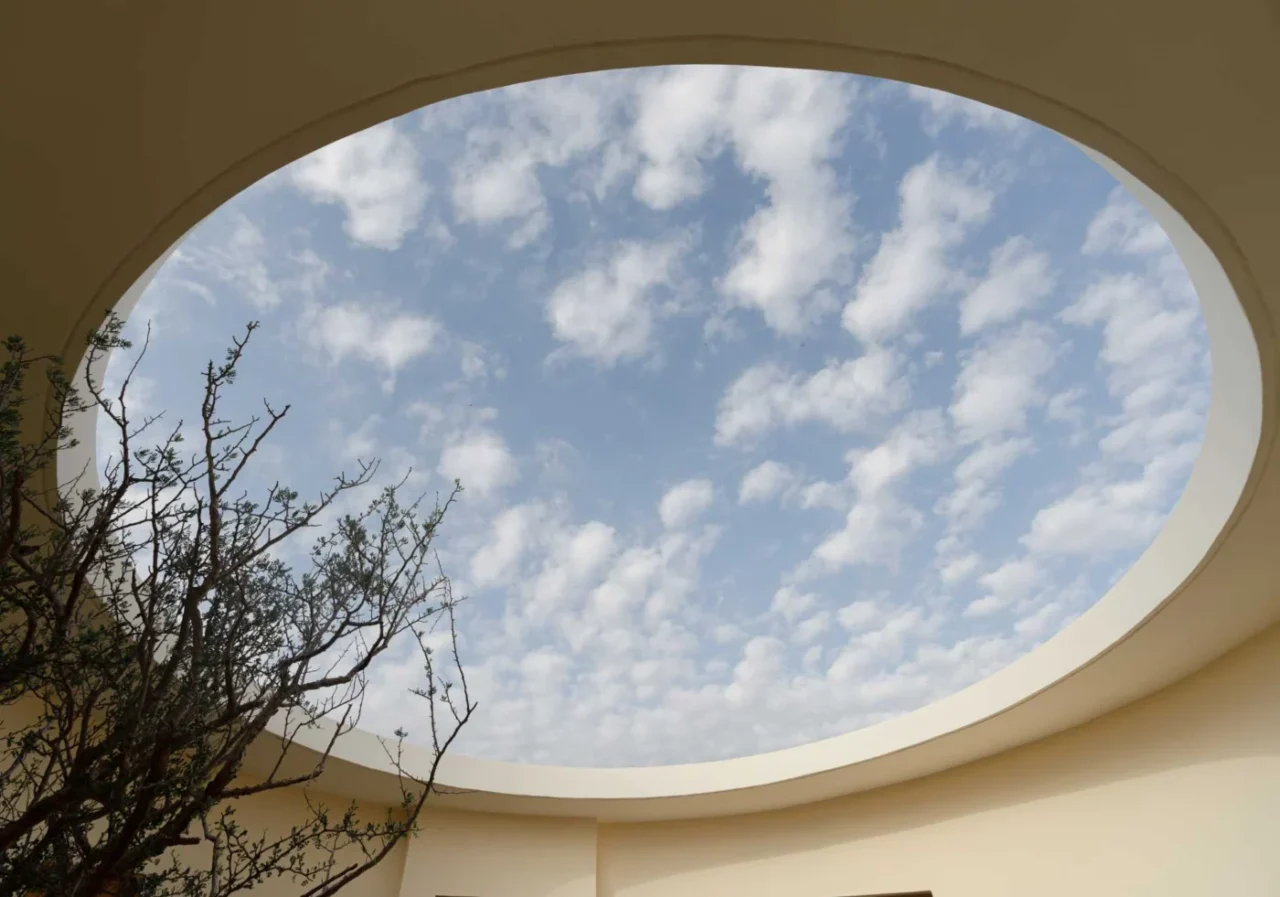 Round opening of the patio framing the night sky