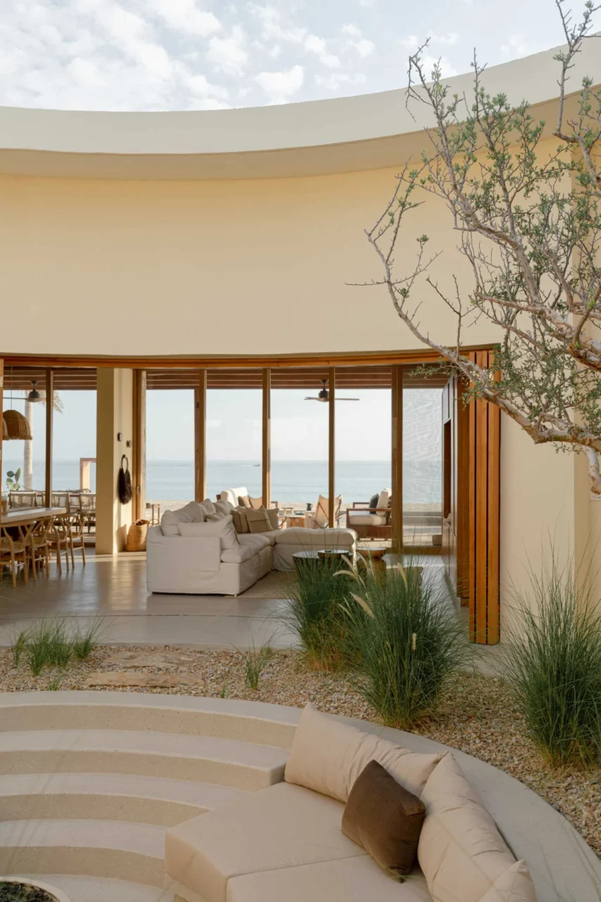 Folding doors along the curved wall around the patio