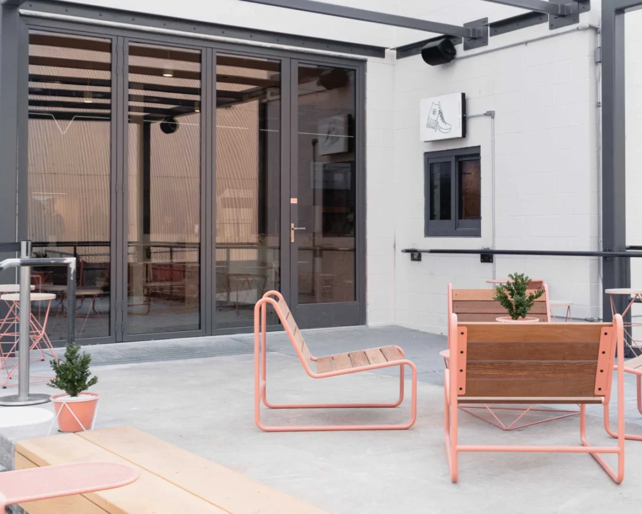 Pink coffee bar inside a former Kraft Cheese factory turned art venue