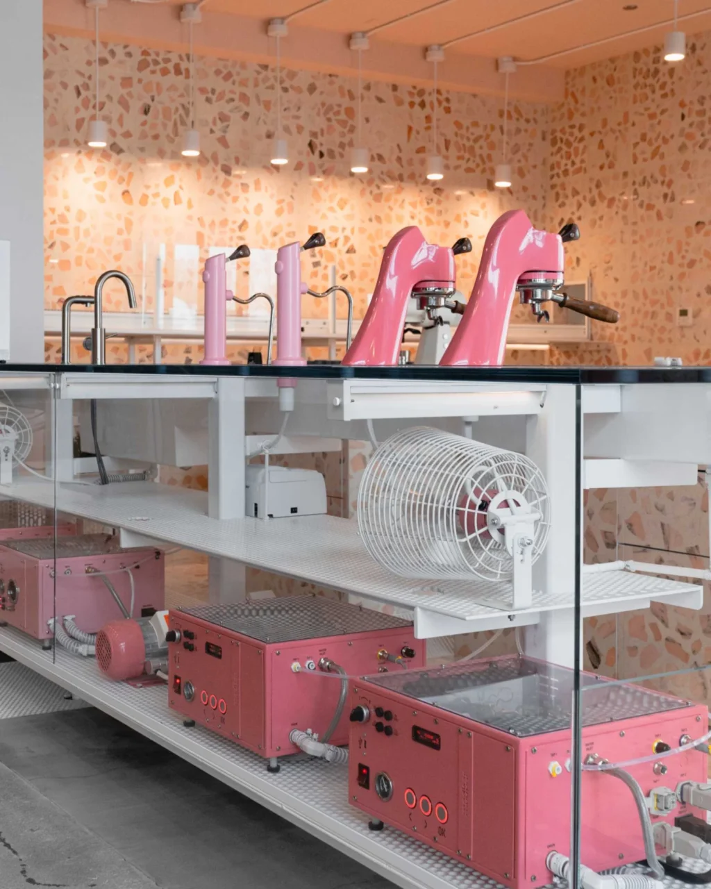 Soft, luminous pink interior of the Bentonville coffee bar