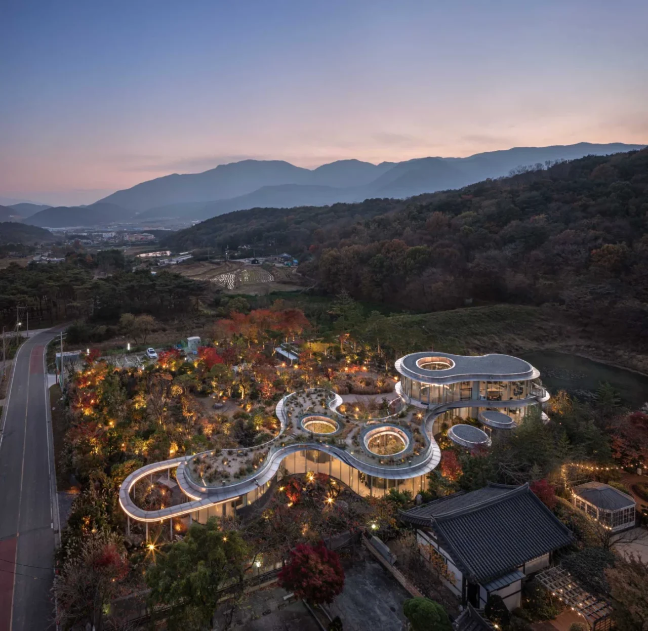 Low curving cafe building blending into its natural setting