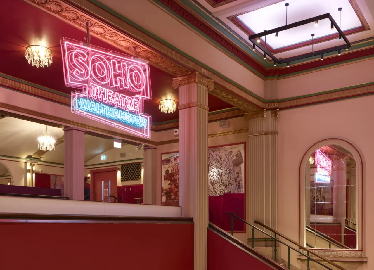 View across the pink foyer towards the upper mezzanine level