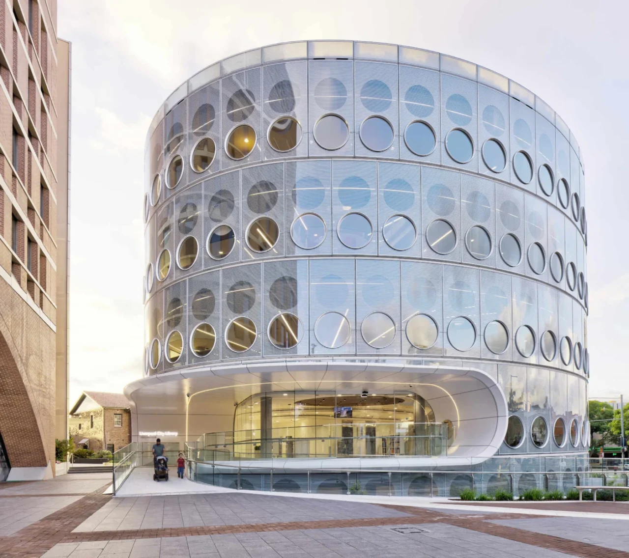 Oval Yellamundie Library at Liverpool Civic Place, Sydney, with round windows covering its facade