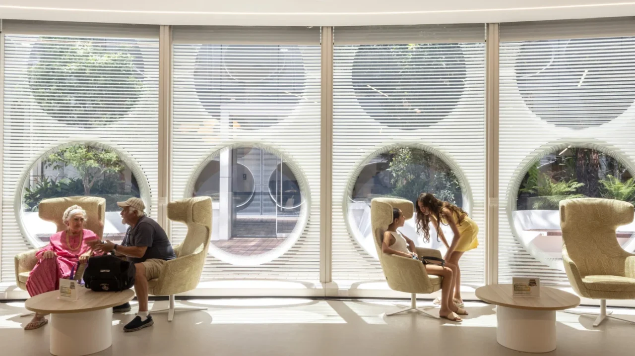 Interior with round windows set in the high-performance facade