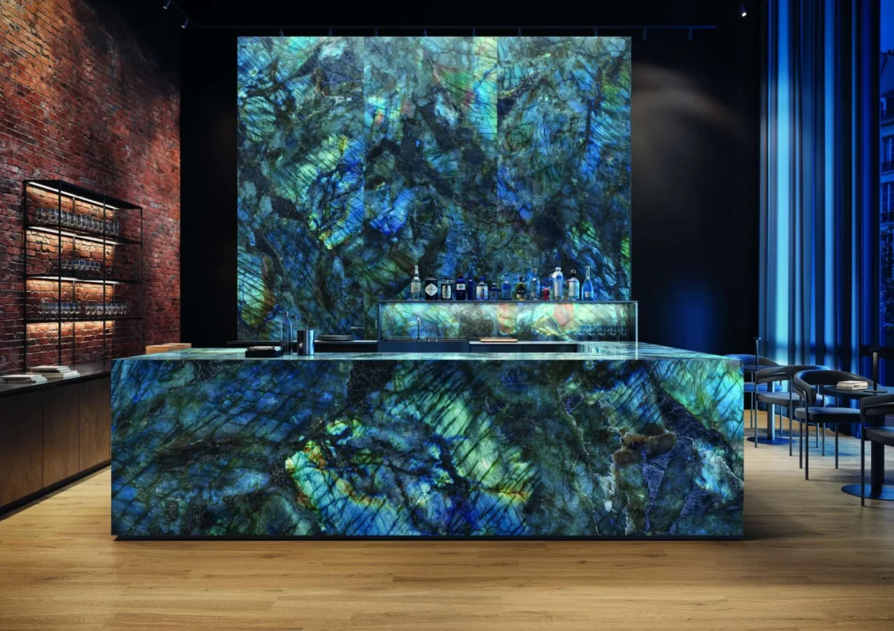 Bar clad in iridescent stone-look surface in blue, green and gold