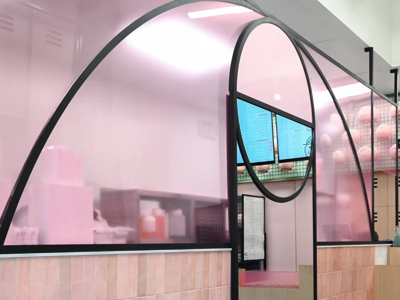 KHAB Tapioca Empress bubble tea shop in Winnipeg with pink plexiglass panels and a menu window