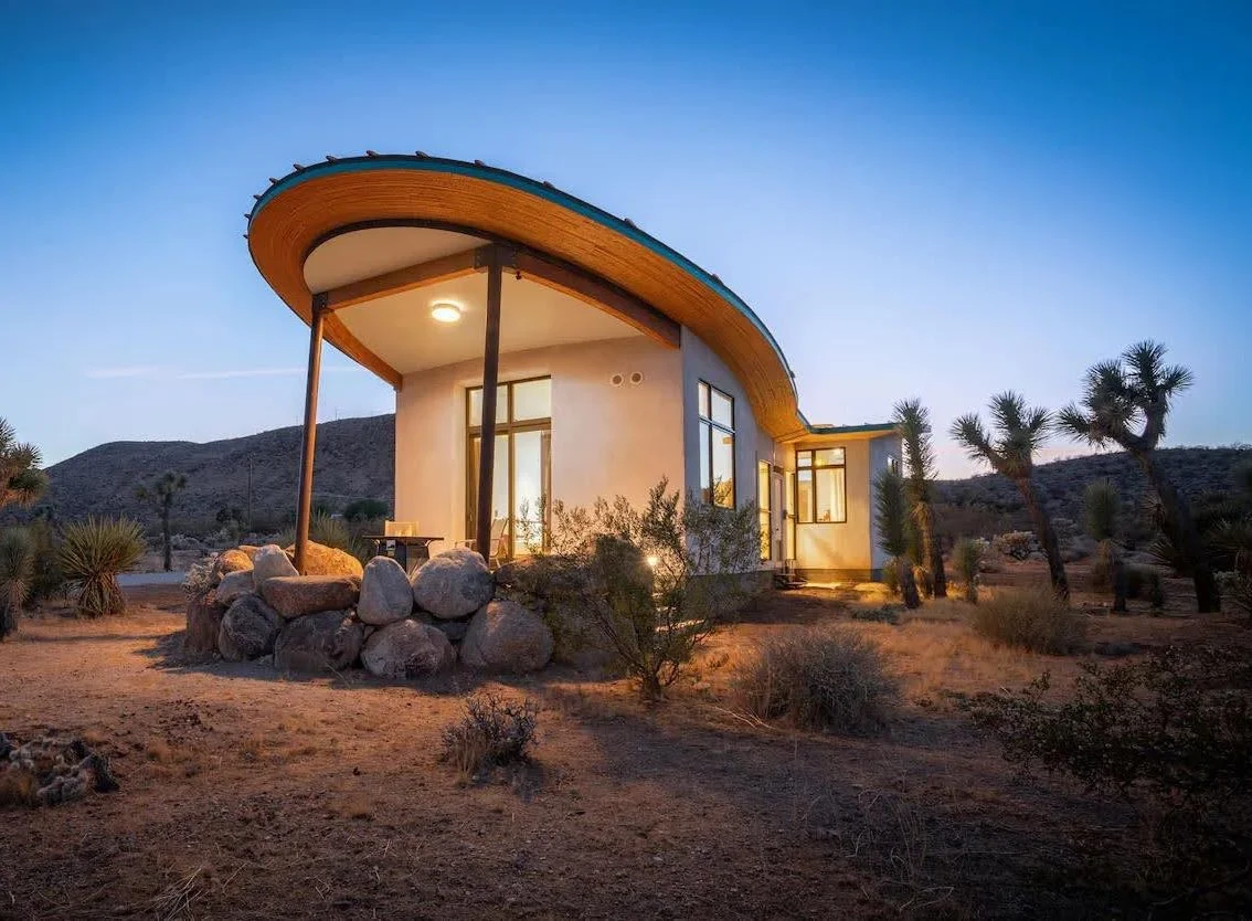 Mesa Sky Disk, a strawbale cabin with a butterfly roof and lime plaster walls in the California high desert