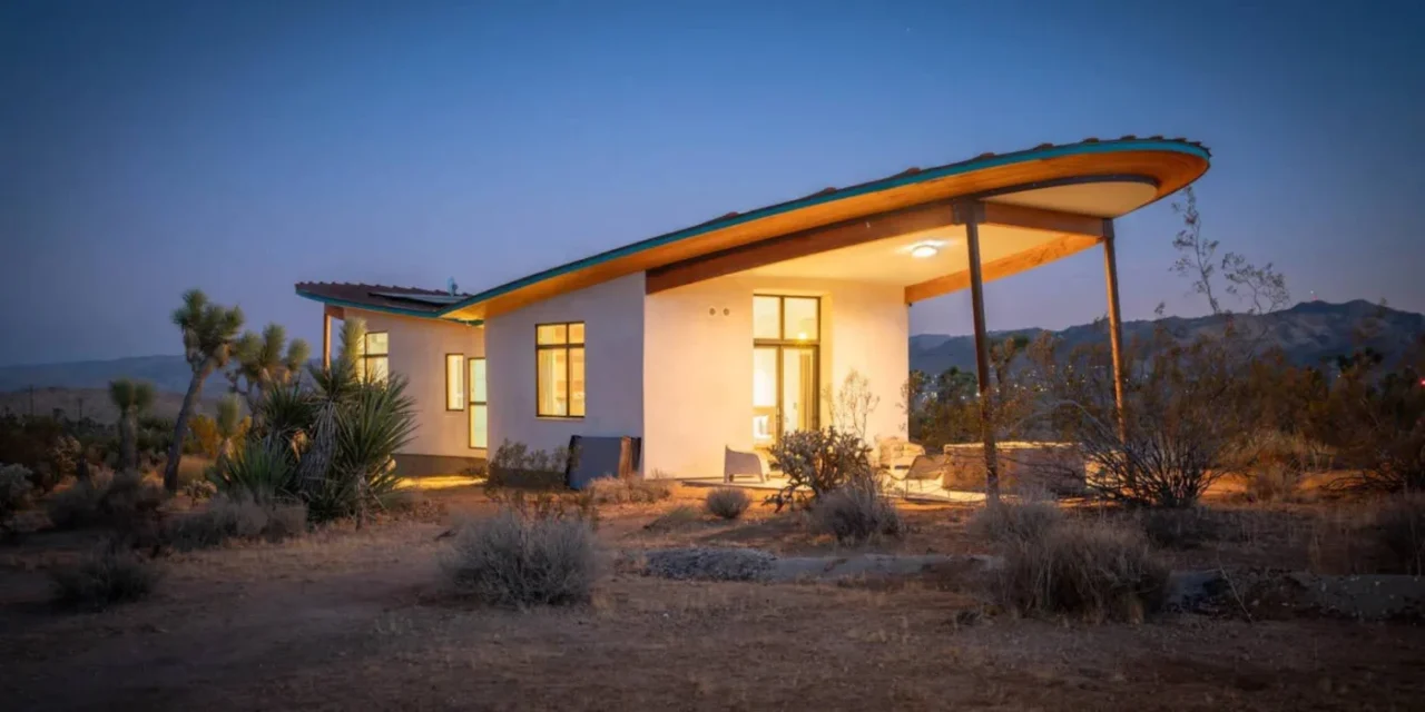 The Mesa Sky Disk strawbale cabin and its butterfly roof in the desert