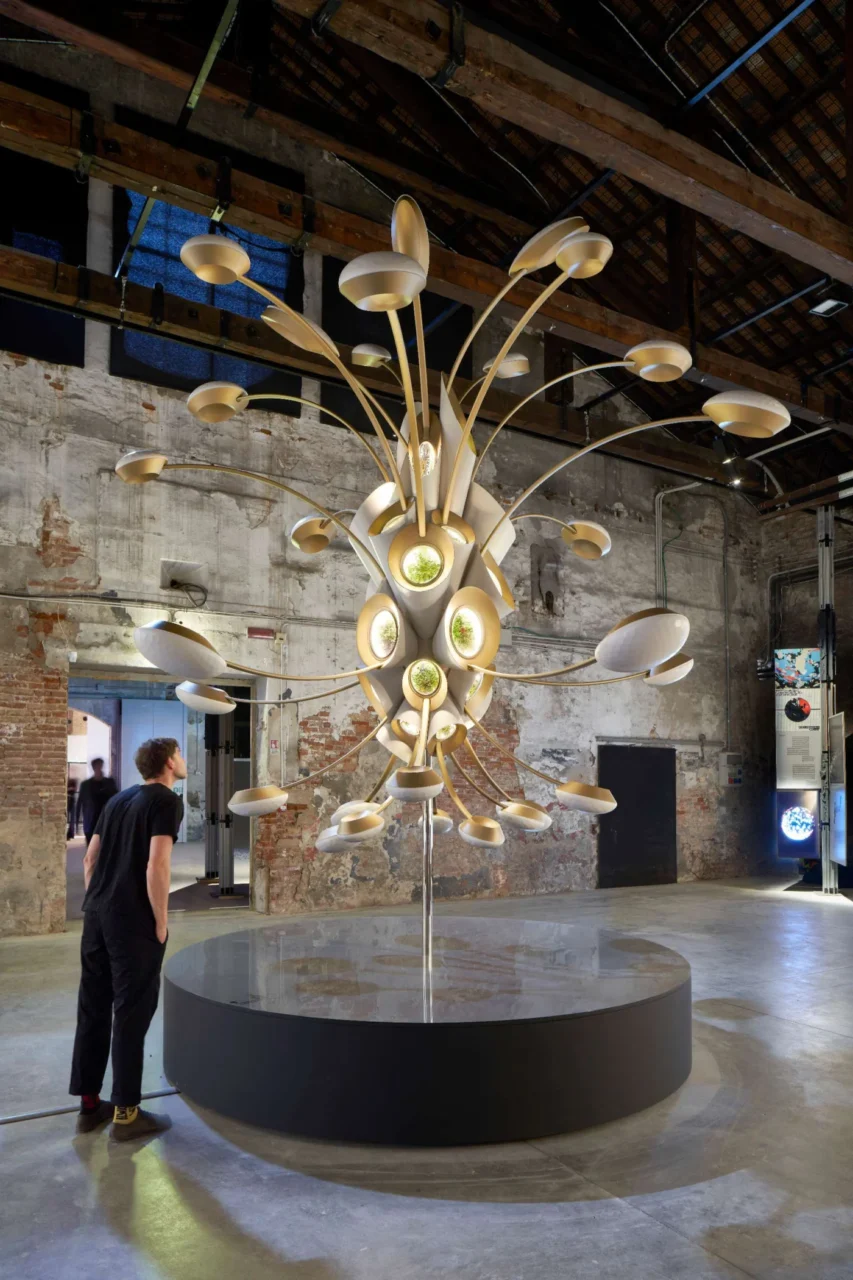 Space Garden model on a circular plinth in a brick exhibition hall in Venice