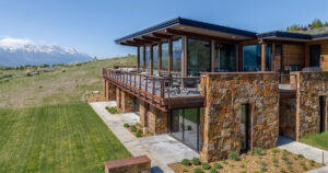 this-grass-roofed-home-with-stone-walls-feels-like-it-grew-from-the-mountain