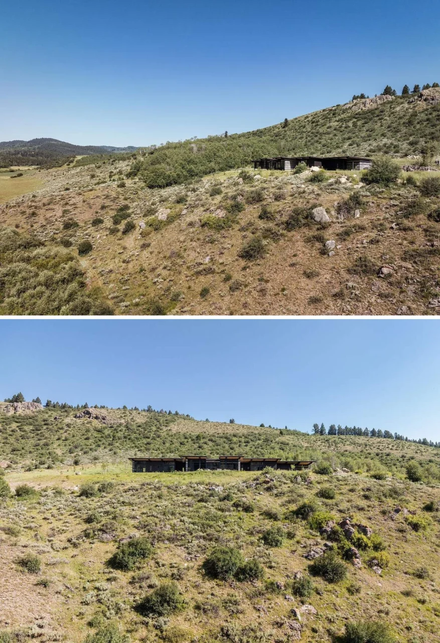 Two long volumes of the house set into the open landscape between Wyoming and Idaho