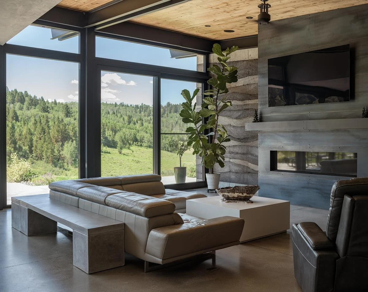 Living room with rammed earth walls and polished concrete floors