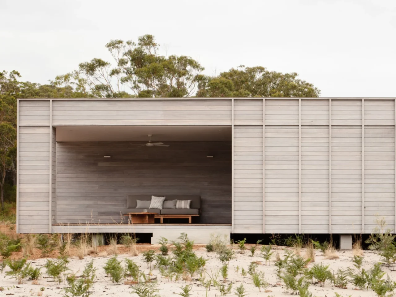 Courtyard House by CHROFI and FABPREFAB, a prefab off-grid home with a deep verandah in Mungo Brush, New South Wales