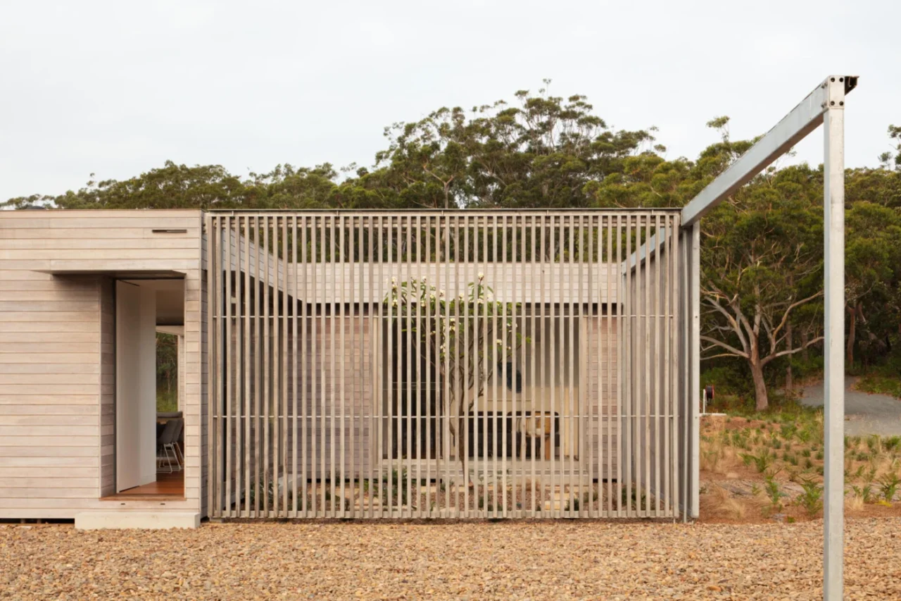 Rear of Courtyard House with the sliding screen opened to the landscape