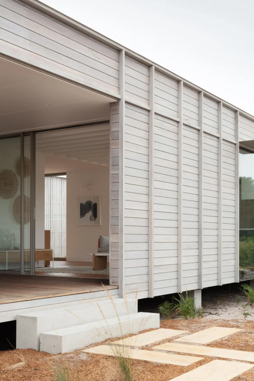 A couple of steps lead from the courtyard into the interior of Courtyard House