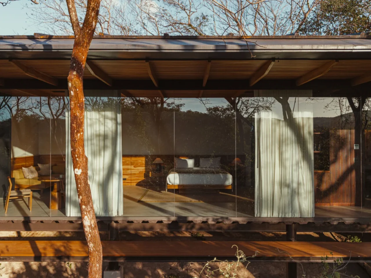 Rio Perdido West Bungalow by Studio Saxe in stone, wood and glass among the forest in Costa Rica