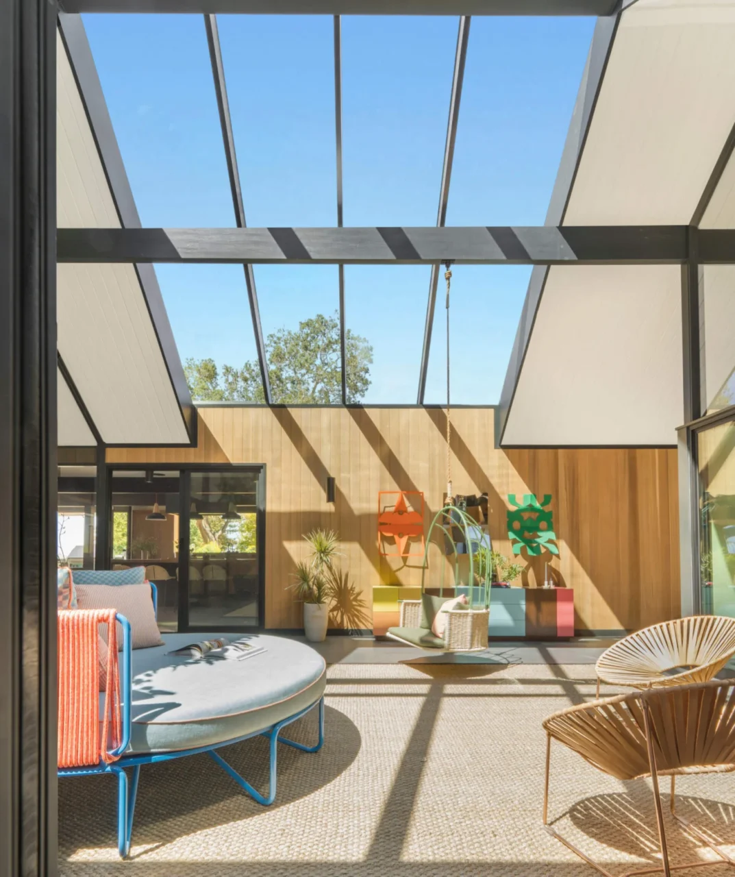 Former open atrium now covered with a glass roof and lined with cedar