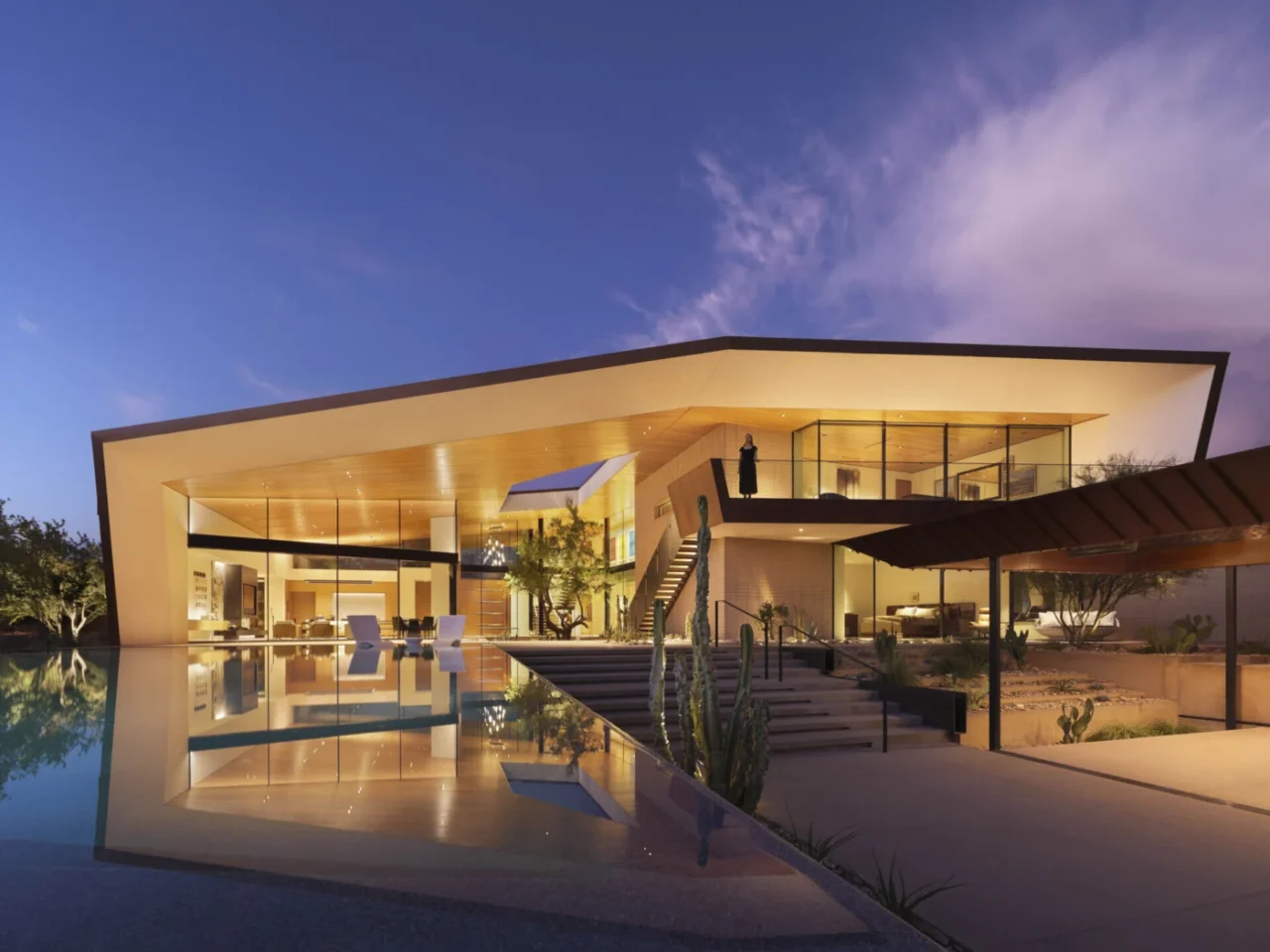 Desert Geode Residence in Arizona with folding weathered metal planes and blasted-face masonry