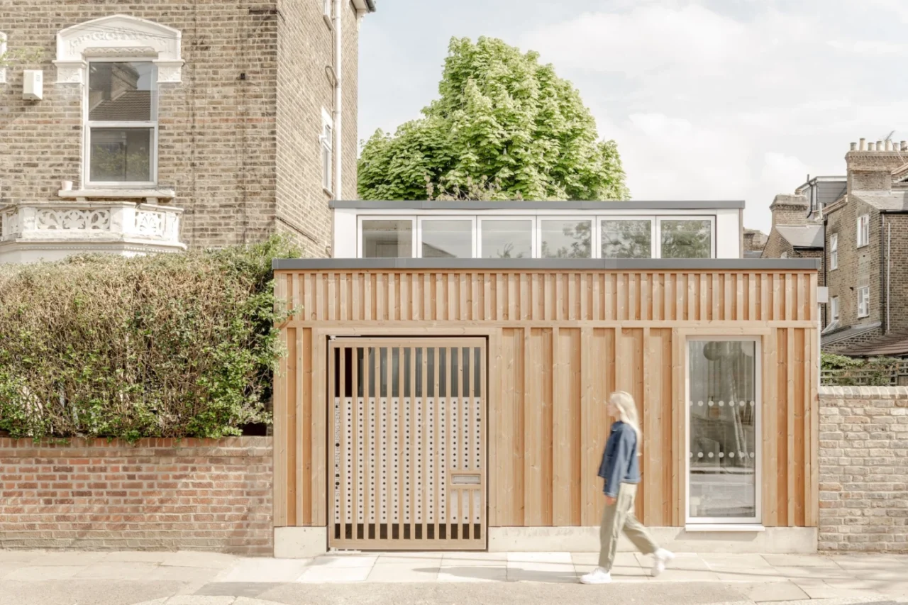 Stroud Green Housing Centre, a single-storey timber-clad office on a residential street in Haringey