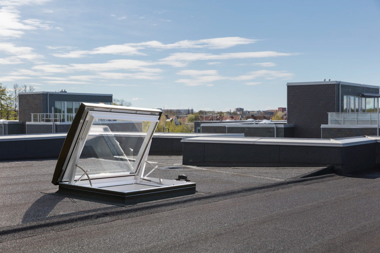 velux-glass-rooflight-electric-roof-exit:-safe-and-seamless-flat-roof-access-–-adc
