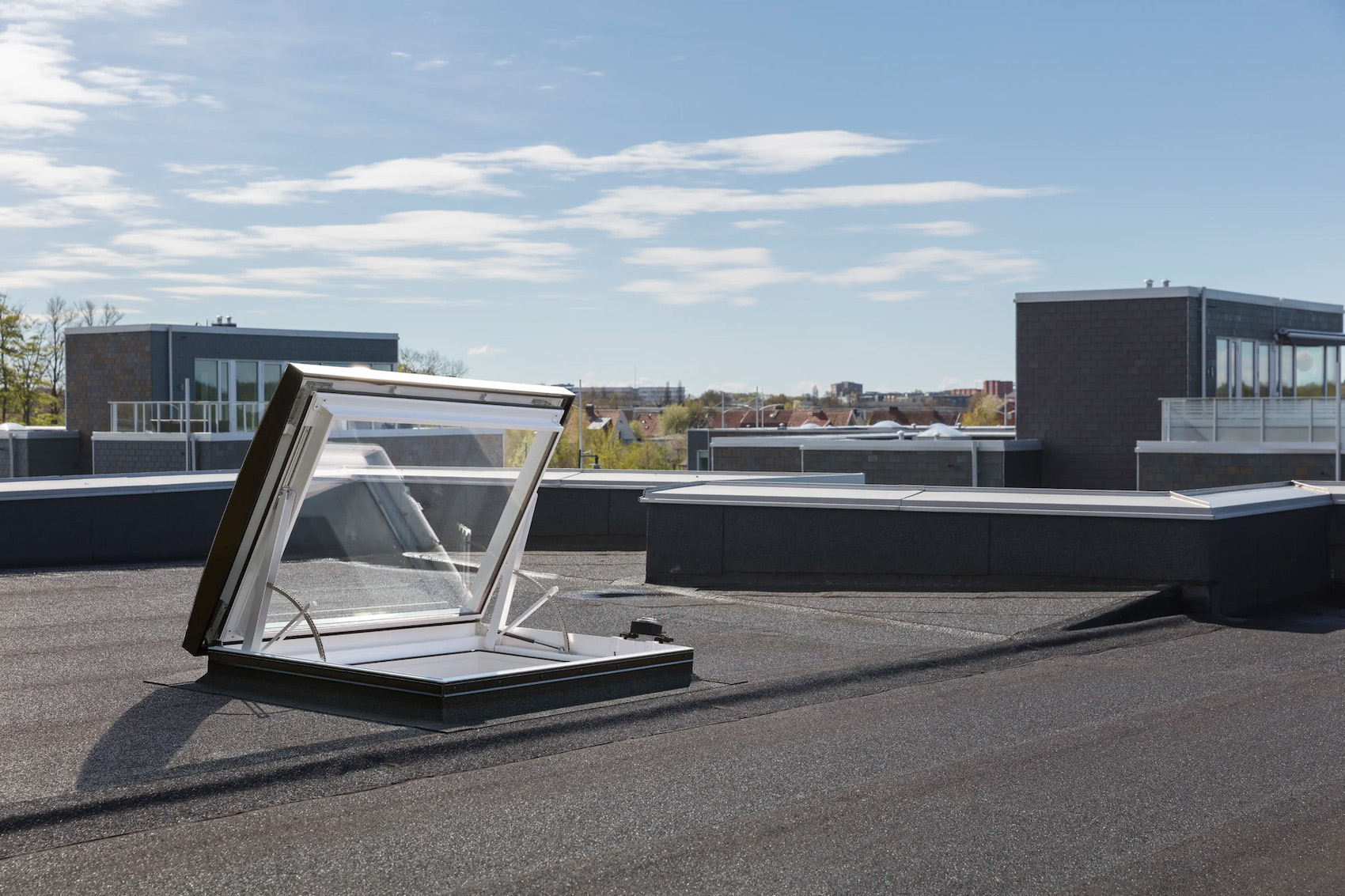 velux-glass-rooflight-electric-roof-exit:-safe-and-seamless-flat-roof-access-–-adc