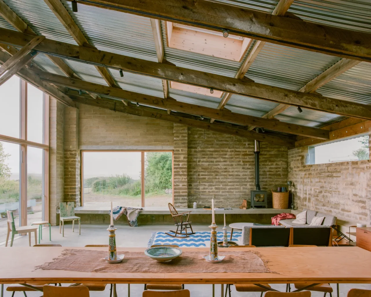Double-height living, dining and kitchen space inside the converted barn